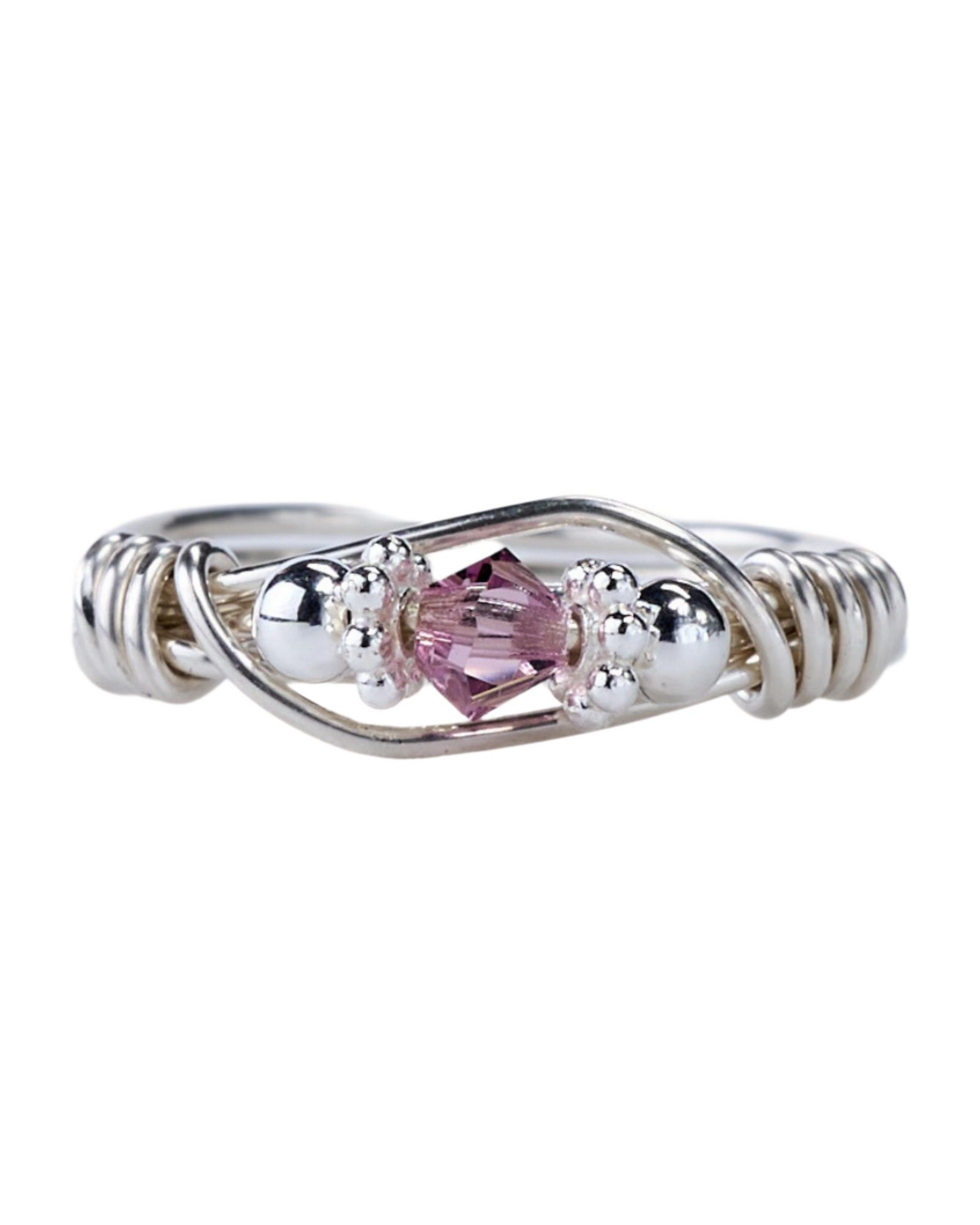 A sterling silver ring with a central purple Swarovski crystal, surrounded by smaller clear crystals, wire wrapping, and silver beads.