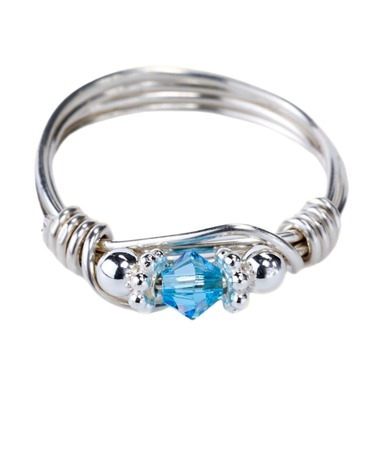 Silver ring with a blue gemstone on a white background