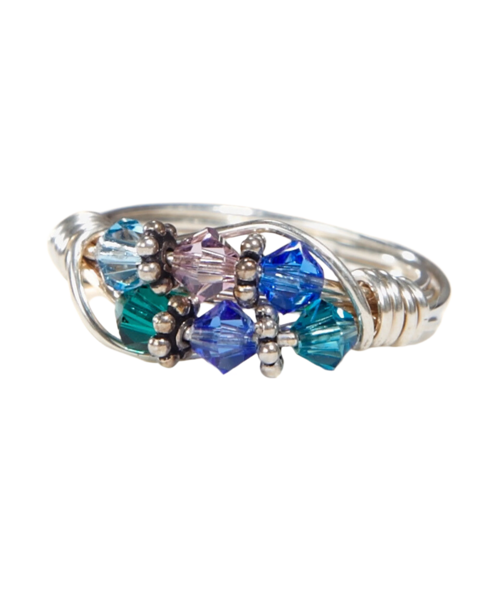 Silver ring with blue, green, and purple gemstones on a white background