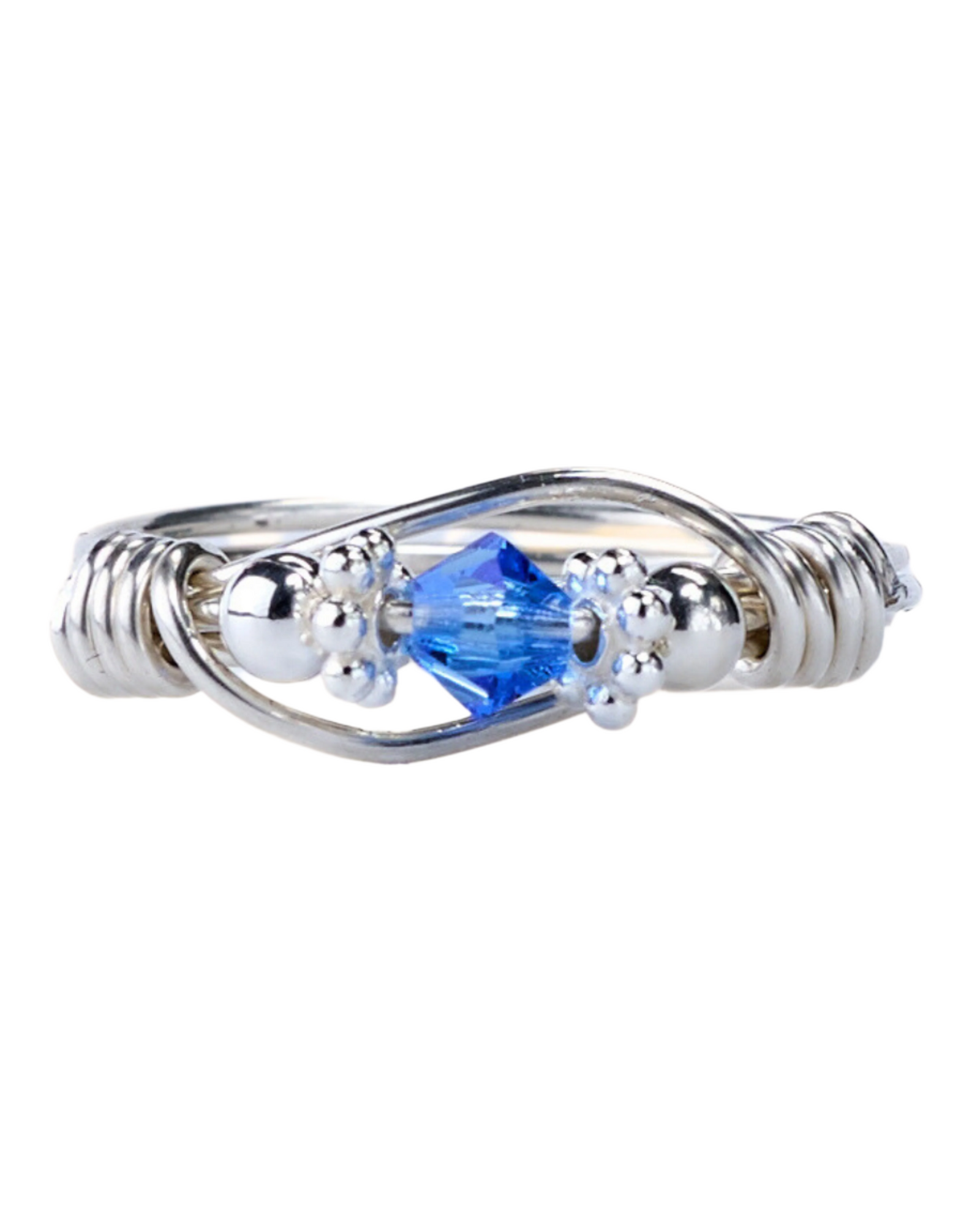 A sterling silver ring with blue Swarovski crystals, wrapped with silver beads and wire.