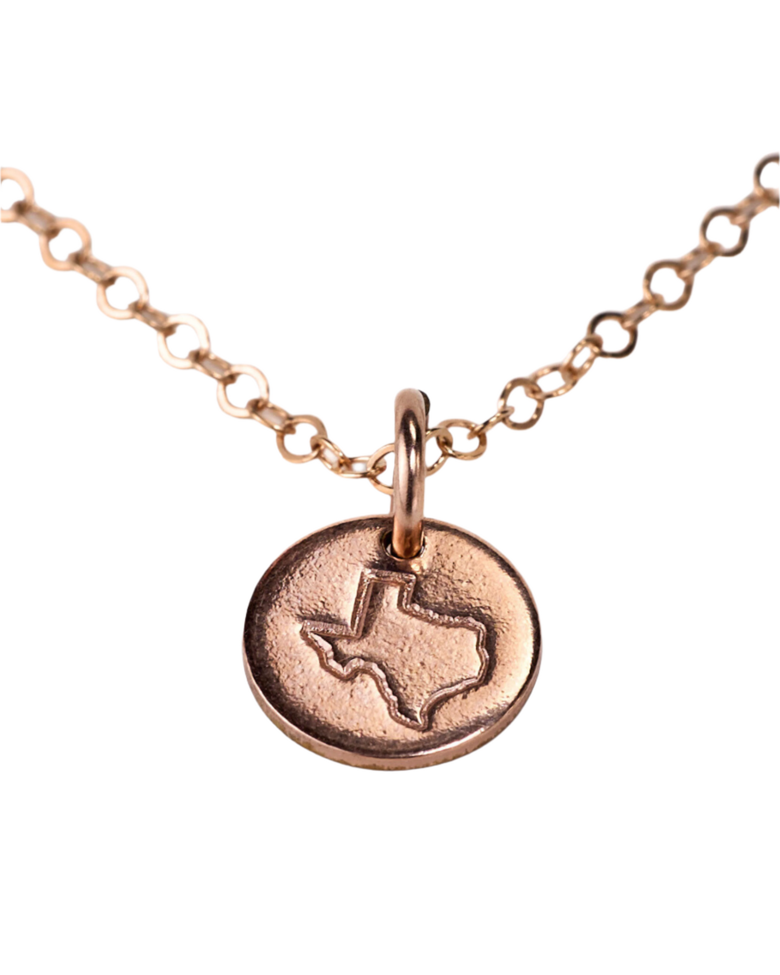 A mini disc necklace with a state outline stamp, attached to a flat cable chain, displayed on a white background.