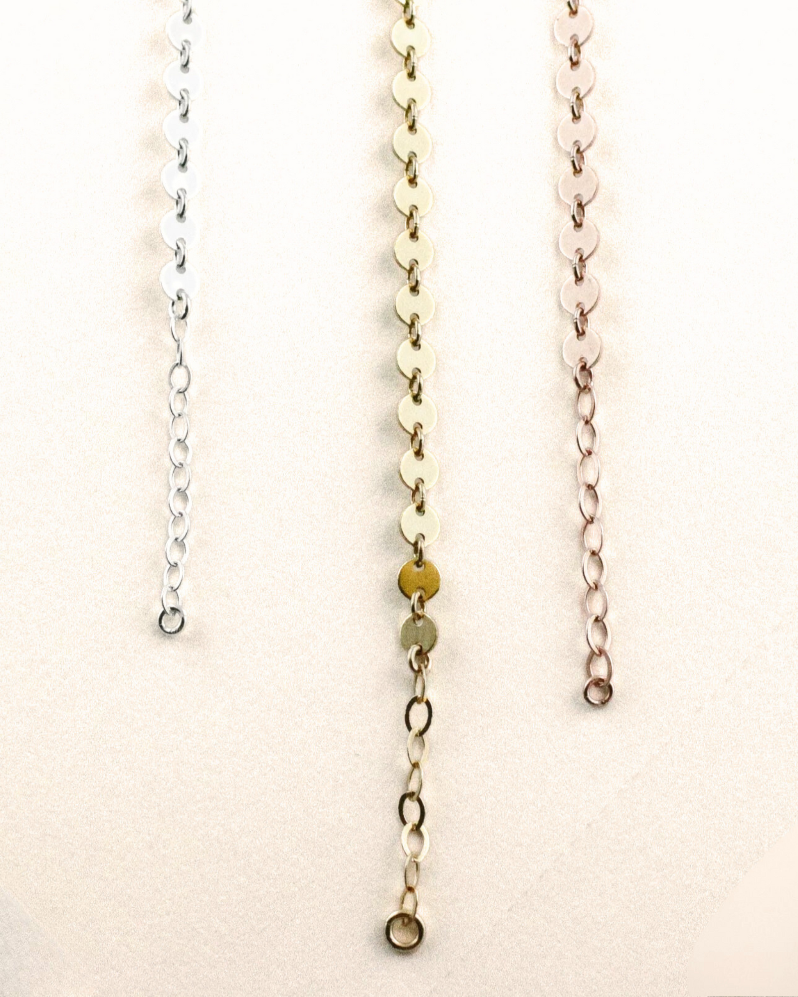 Three Stella Bracelets displayed in a row with varying colors. The first is silver, the second is gold, and the third is rose gold.